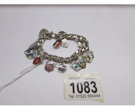 A continental silver bracelet (large link belcher) with 19 enamel town shield crests, gross weight 45 grams.