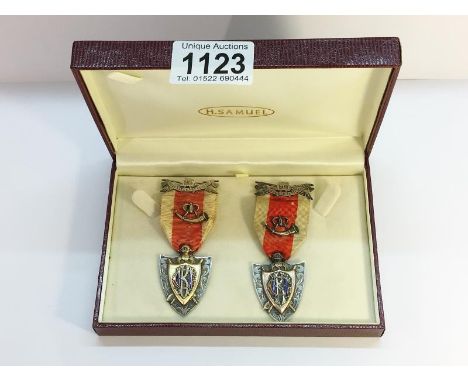 2 silver &amp; enamel fraternal medals for the Grand United order of the Knights of the Golden Horn featuring hunting horn em