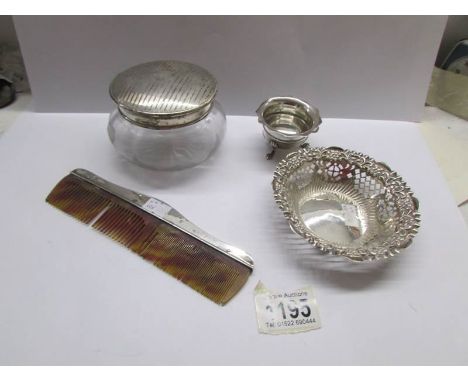 A Silver fretwork dish, a silver salt, a powder bowl with silver lid and a silver backed comb (all hall marked).