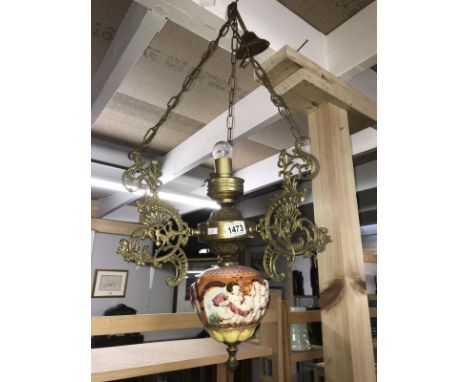 A brass and ceramic ceiling light,.