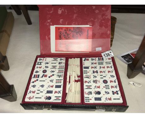 A Gibson games bamboo backed mahjong set.