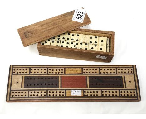 A set of dominoes with cribbage board