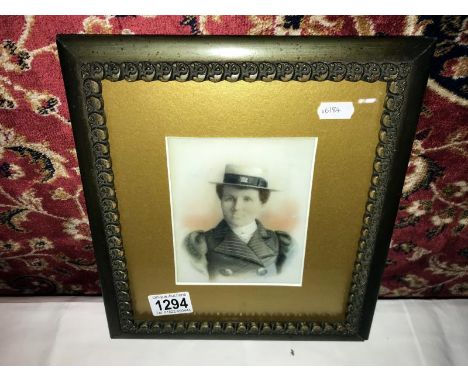 A painting over photo on milk glass portrait of a lady featuring Union Jack on hat ribbon.
