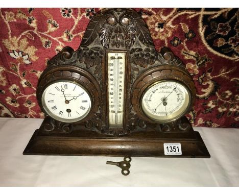 An Edwardian carved oak clock/barometer/thermometer by J Spiers, Leighton Buzzard.