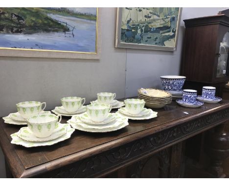 A part Victorian blue &amp; white tea set including 3 trios, 6 paragon trios with green footed cups and 6 new hall porcelain 