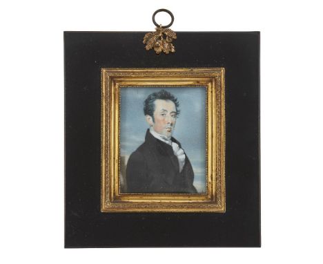 A Regency portrait miniature of a gentlemen, early 19th century, painted on ivory, the black-haired gentleman wearing a black