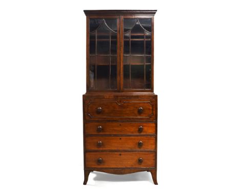 A Victorian mahogany secretaire bookcase, late 19th century, with moulded cornice over astragal glazed doors enclosing three 