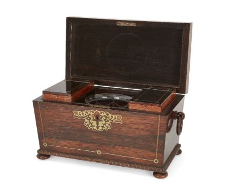 A late Regency brass-inlaid rosewood tea caddy, c.1820-30, of sarcophagus form with ring handles, the fitted interior with tw