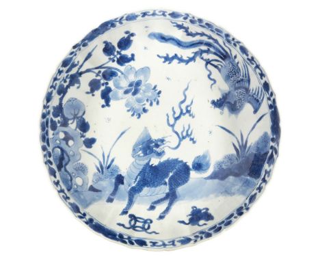 A Chinese porcelain blue and white 'kylin and phoenix' dish, Kangxi period, the interior painted with a kylin and phoenix amo