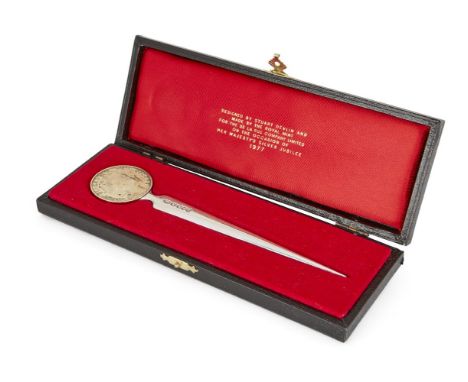 A parcel gilt silver letter opener by Stuart Devlin, London, 1977, in signed, fitted case, the letter opener commemorating th
