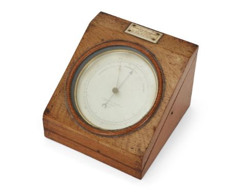 A Victorian brass aneroid barometer, by Negretti & Zambra, London, mid-late 19th century, the silvered dial calibrated in bar