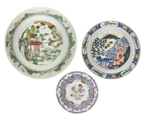 A Chinese export porcelain dish, a Famille verte charger, and a Delft plate, 18th-20th century, the dish painted in famille r