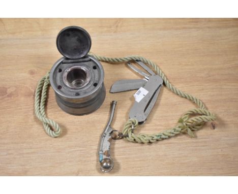 A Victorian pewter inkwell of cylindrical form with glass liner, measuring 6cm high, and a Barlow's Shackler knife with attac