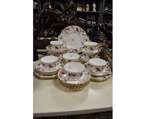 A Collection of Minton 'Ancestral' tea cups, saucers, sugar basin and plate, having delicate floral transfer pattern in brown