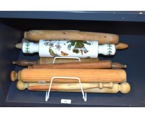 A collection of vintage wooden rolling pins and a Portmeirion botanicals rolling pin.