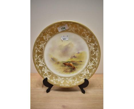 A hand painted Royal Worcester plate, circa 1916, having Highland cattle and mountain scene depicted to centre, with gilt hei