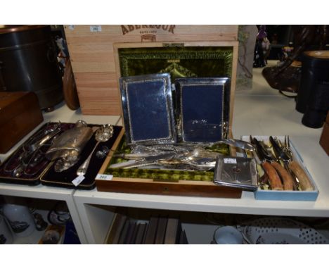 An assortment of vintage and antique flat ware, including Mother of Pearl handled knives and forks, hip flask, embossed spoon
