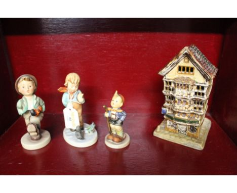 Three Hummel figural ornaments and a Royal Dux Cottage ornament