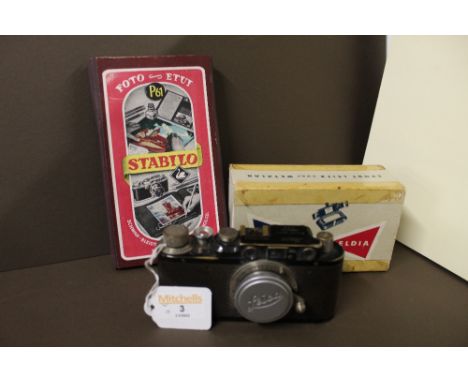 Leica vintage camera (No. 172703), a boxed Leitz Wetzlar handheld camera and a box of Stabilo photograph colouring pencils