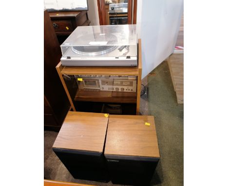 A 1980's walnut effect music cabinet containing Hitachi AMFM studio receiver model SR2010L and Hitachi single tape deck and t