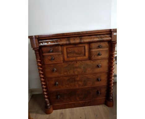 A 2 DRAWER OVER 3 DRAWER WALNUT SCOTCH CHEST WHICH ALSO INCLUDES SECRET DRAWER
