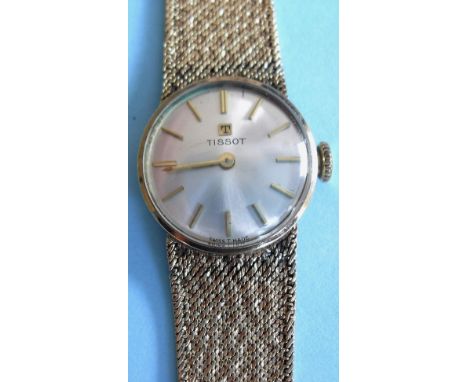 A Tissot lady's 9ct gold bracelet watch, round steel dial, applied yellow batons matching to arrow-style hour and minute hand