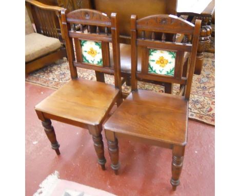 Pair of Edwardian hall chairs with unusual tile backs