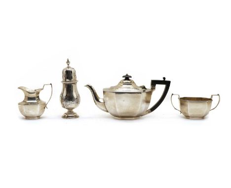 A silver three piece tea service, London 1933, the teapot and milk jug by J Taylor, the sugar bowl by CA, together with a sug