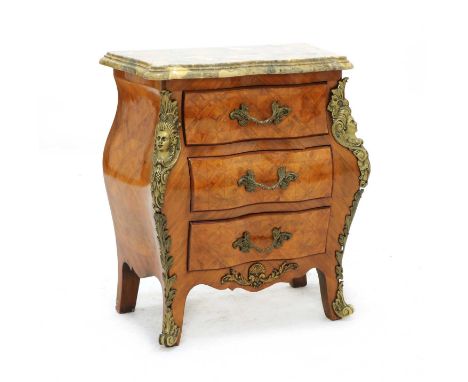 A Louis XV style kingwood petit commode, the serpentine marble top above three drawers on shaped feet. 60cm wide, 34cm deep, 