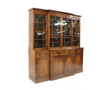 A Regency mahogany breakfront secretaire bookcase, early 19th century and later’, the detachable cornice over bar glazed door