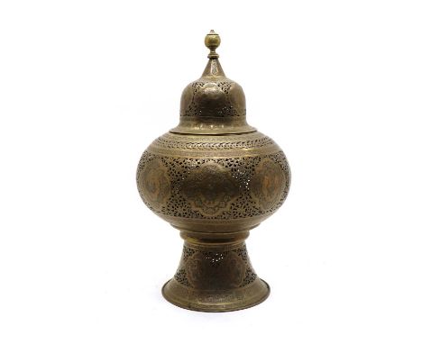 A Persian pierced and engraved brass mosque lantern, having reserve panels decorated by portrait detail within a pierced foli