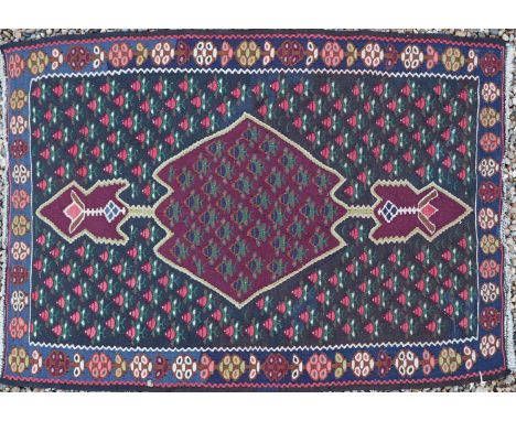 A Sine Kilim rug, 99 x 69cm, together with three Afghan tent frieze textiles, 300cm, 260cm and 200cm long, a Kazak bag, 76cm 