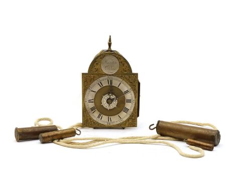 A brass lantern clock, by Martin, London, the arched dial having engraved spandrels, silvered chapter ring with Roman numeral