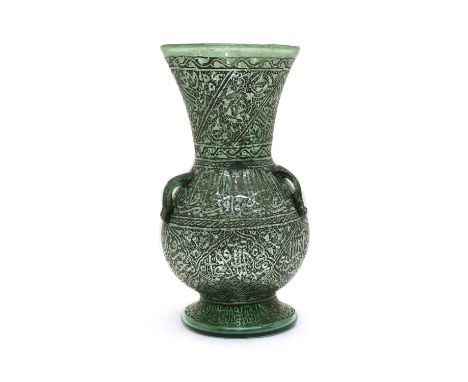 A late 19th early 20th century glass mosque oil lamp, the hand-blown globular body and frustoconical neck with three loops et