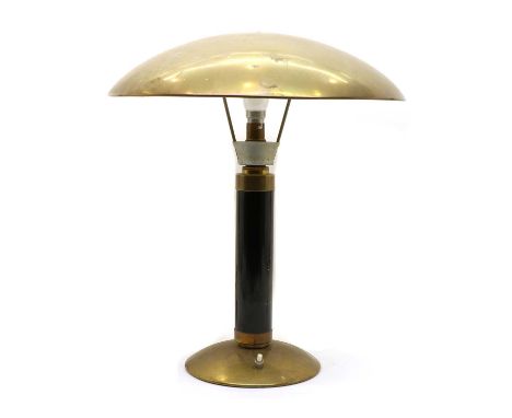 A mid century modernist brass table lamp, the domed circular shade, raised on a cylindrical ebonised column and domed foot, s