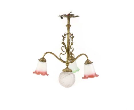 A brass four-light electrolier, early 20th century, with three arms and scrolling foliate decoration, with various opaque gla