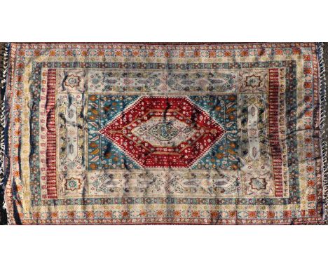 A Berber wool carpet, 20th century, decorated with geometric motifs on a red ground, with tasselled ends, 455 x 288cmConditio