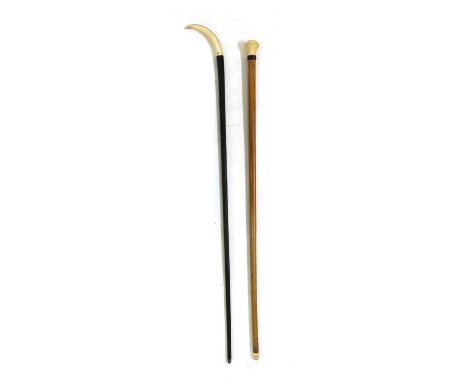 A malaca walking cane, late 19th century, the turned ivory handle with a plaited leather collar and an ivory tip, 90cm long a