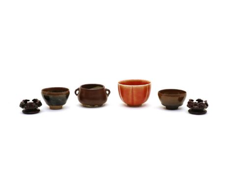 A Chinese pottery incense burner, of squat form with two handles, covered under a brown glaze, 8cm long, two Jian-ware tea bo