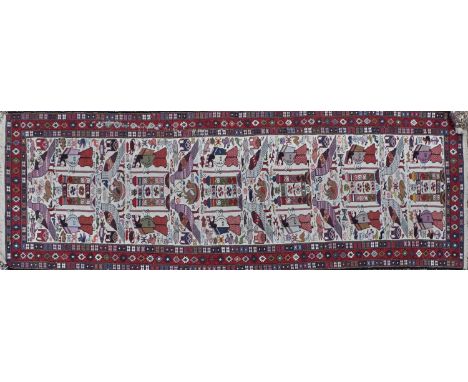 A Kilim runner, decorated with stylised figures and birds, 300 x 83cmCondition report: Pulls, wear and losses throughout