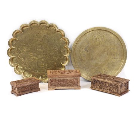 Two large brass trays, 20th Century, one Indian of lobed form, 71cm diameter, the other circular with kufic inscription, 65cm