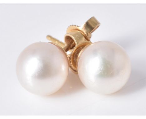 
	
		A pair of cultured pearl ear studs, the 8mm cultured pearl, with post fittings, signed Mikimoto, stamped 750, 2.4g gross
