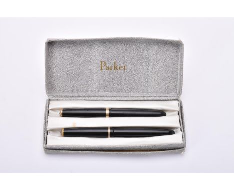 
	
		Parker, Duofold, a black fountain pen, the cap with a gilt arrow clip and cap band, the nib stamped 14K, squeeze bar fil