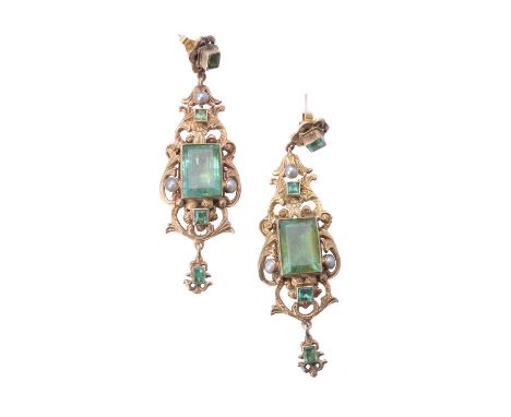 
	
		A pair of pre 1950 Continental emerald and half pearl earrings, the openwork scrolling ear pendants set with rectangular