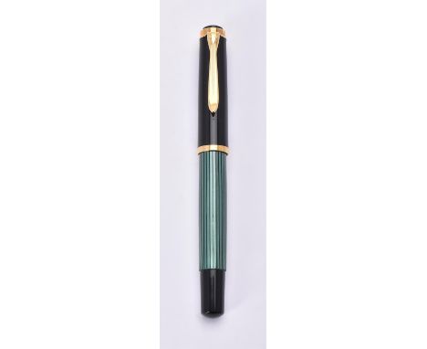 
	
		Pelikan, Souveran M400, a green and black fountain pen, the cap with gilt clip and double cap band, the fine nib stamped