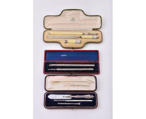 
	
		Y&nbsp;A cased silver dip pen and propelling pencil, with wrythen decoration, the dip pen 5cm (6in) long; a cased mother
