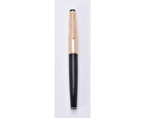 
	
		Montblanc, 72, a black fountain pen, the gilt cap with a clip, winged nib, ink viewing window, piston filling system, in