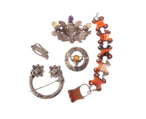 
	
		A Victorian citrine and amethyst Scottish thistle brooch, circa 1860, with naturalistic textured leaves to three citrine