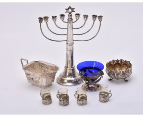 
	
		A silver Menorah, maker's mark obscured, Birmingham 1926, with a star finial, eight branches, a tapering stem and a circ