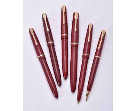 
	
		Parker, Duofold, a red fountain pen, the cap with gilt metal arrow clip and cap band, the nib stamped 14K, squeeze bar f